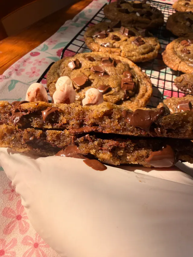 A gooey Limited Edition_Father's Day cookie broken open with melted chocolate in the centre.