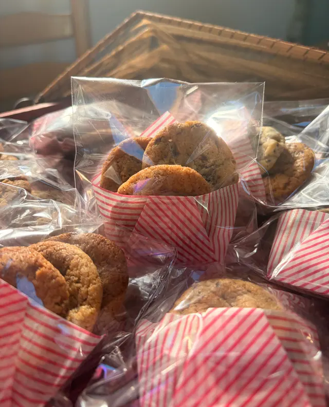 A stack of mini yummy bites cookies packaged for gifting.